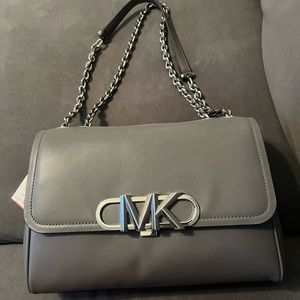 Brand new Michael Kors purse, tags still on it!